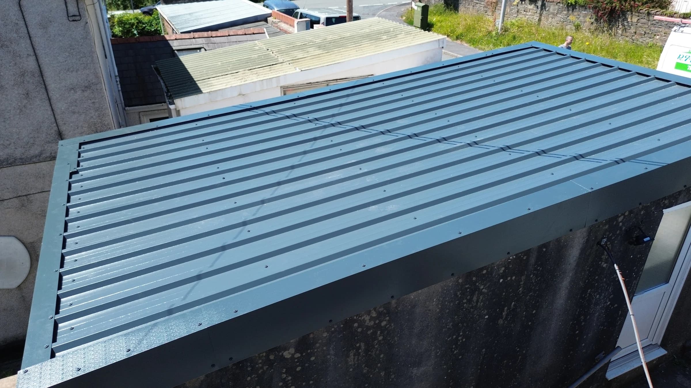 Completed box profile metal sheet roof with new trims, Neath