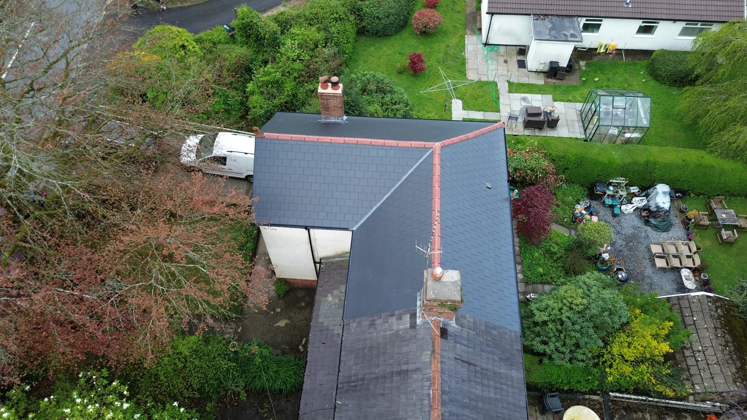 Completed slate roof and chimney, aerial view, South Wales