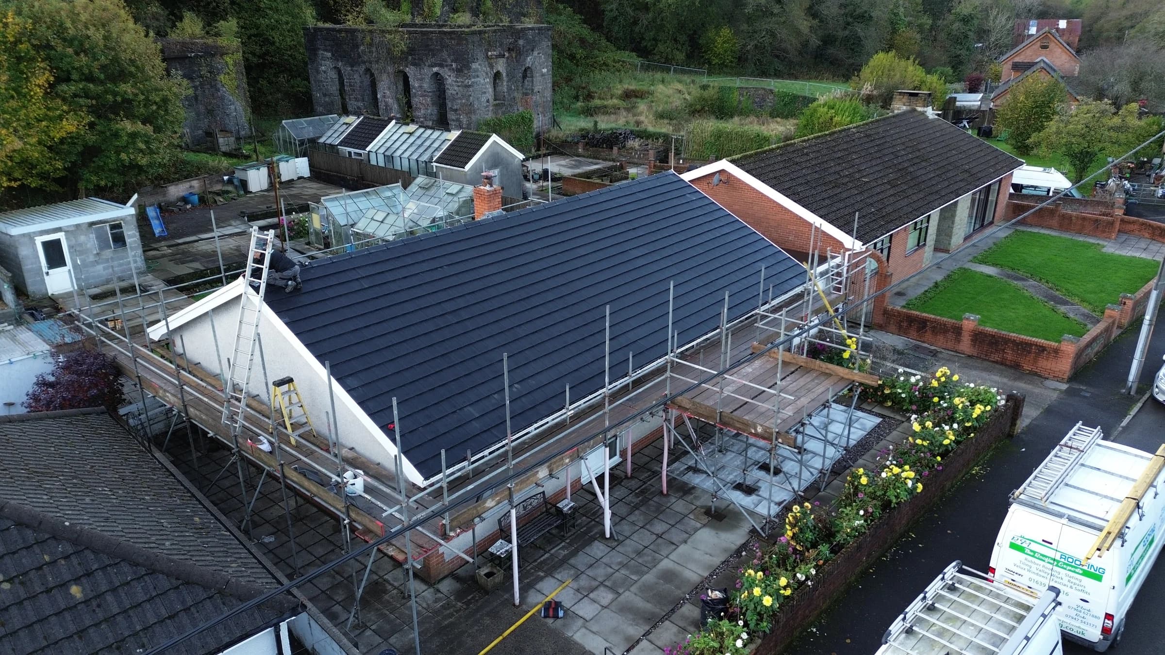 Full roof replacement on a bungalow with scaffolding up, Neath